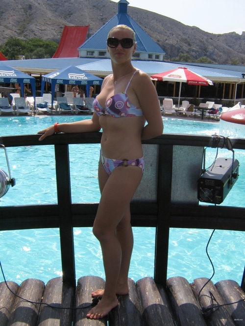 Sexy Friend Sunbathing at the Beach: Hot Bikini Babe Relaxing by the Sea