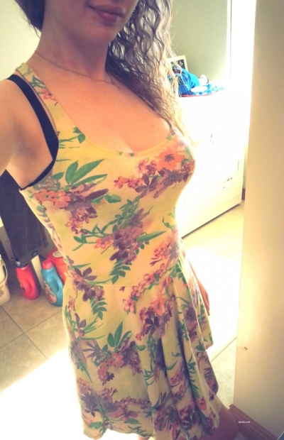 posing in a summer dress and without it