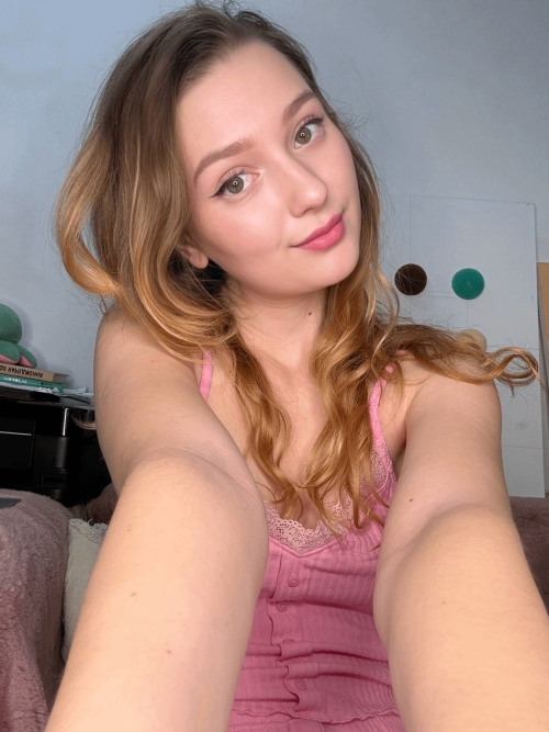 Young girl spreading legs to show holes in explicit pose