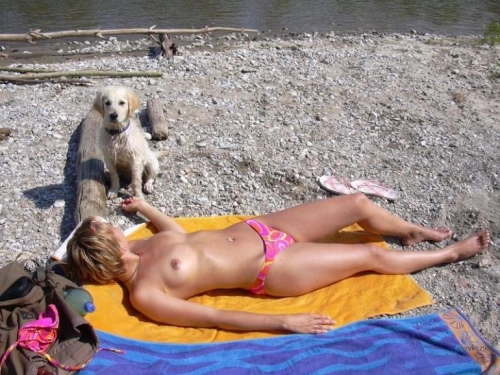 Topless Beach Babe: Sensual and Provocative Girl Sunbathing