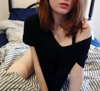 Red-haired girl gradually gets naked