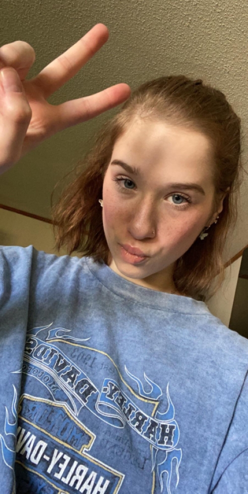 Skinny girl shows off her fluffy pussy in explicit photo session.