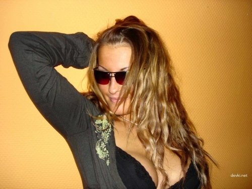 Sun-Kissed Woman Flaunting Her Assets - Explicit Photo