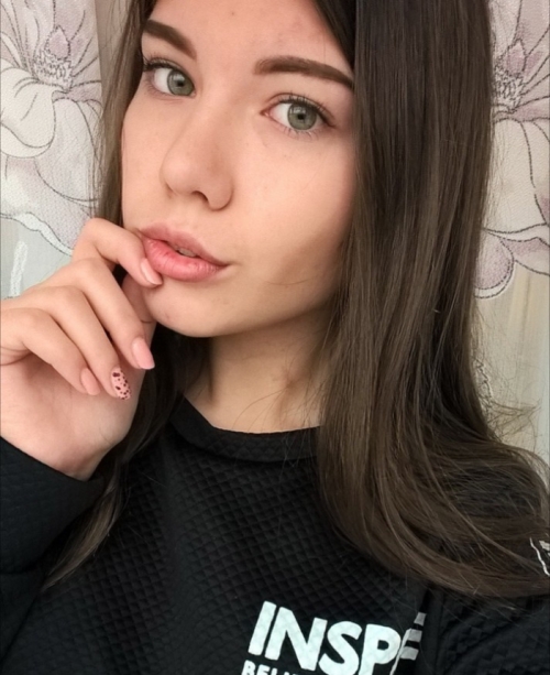 Young Brunette with Small Breasts Poses Nude for Explicit Photoshoot