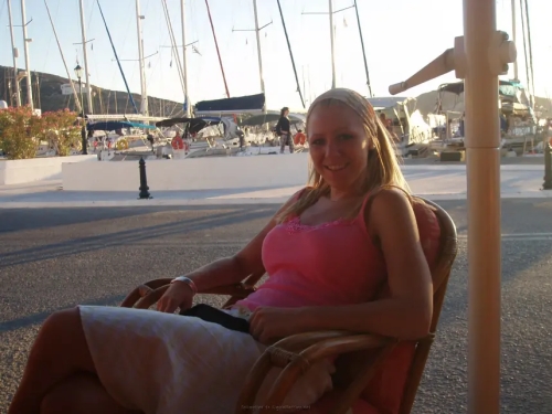 Blonde Flaunts Tanned Tits: Explicit Topless Photoshoot