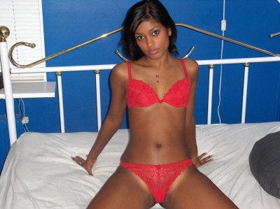 Erotic photo shoot of a slender mulatto girl
