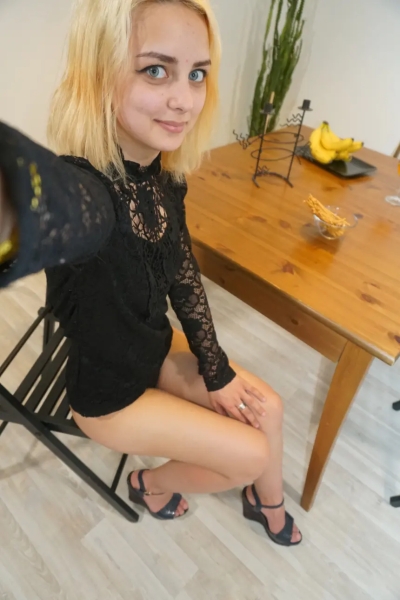 Cute blonde teases on the office sofa