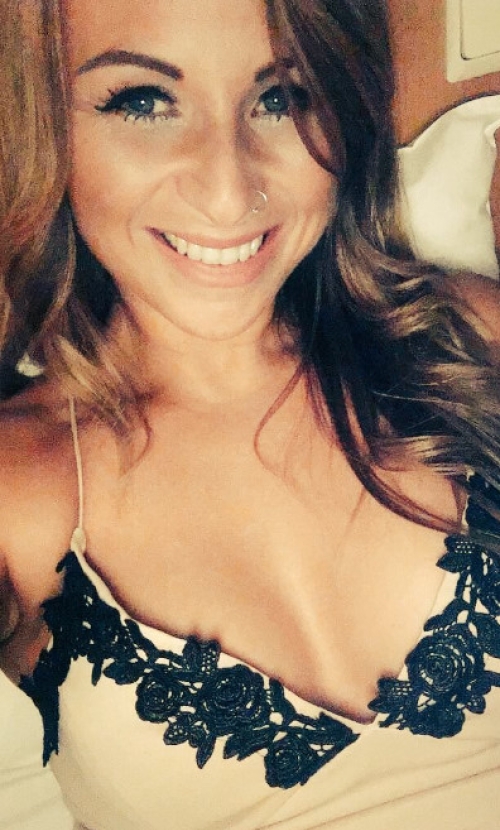 Exposed bare breasts: Explicit photo of a woman showing her naked chest