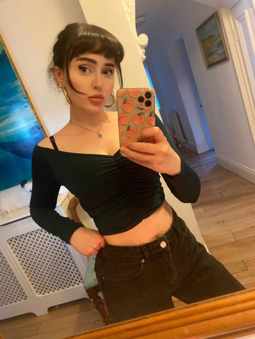 Young dark-haired girl flaunts bare breasts in tights and without them