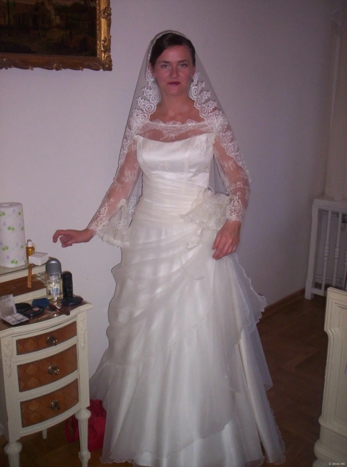 Lacy bridal lingerie on a curvy milf teasing you