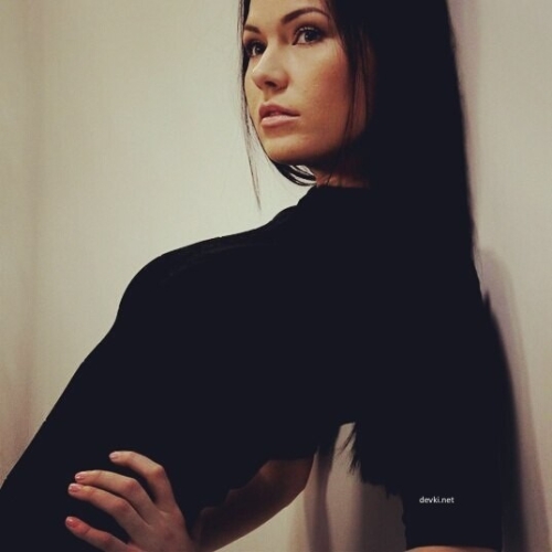 Sexy Witch Takes Selfie on Smartphone: Seductive Sorceress Captures Magic Moment