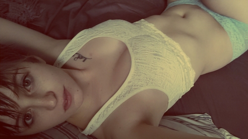 Amateur Photos of Young Woman with Tattoos and Piercings