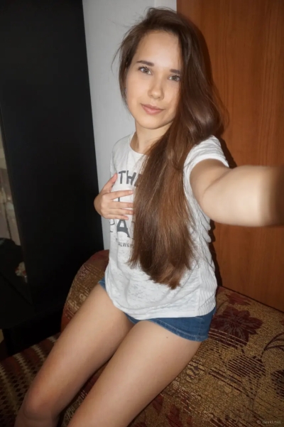 Long haired teen loves posing and filming nude