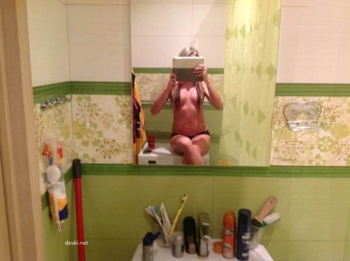 Sexy Girl Taking Selfies: Hot Babe Capturing Herself in Seductive Pose