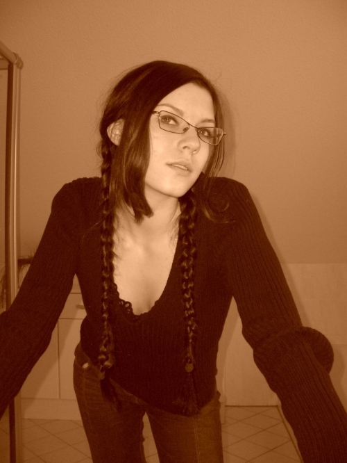 Modest Girlfriend Exposing Her Assets in Provocative Lingerie