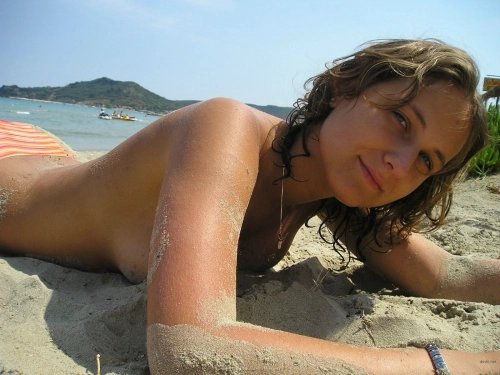 Topless Girl Sunbathing: Explicit Beach Vacation Photo