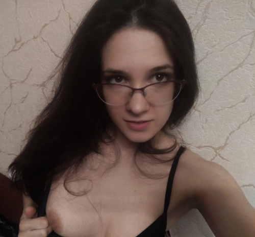 Seductive Brunette with Perfect Curves Poses Confidently