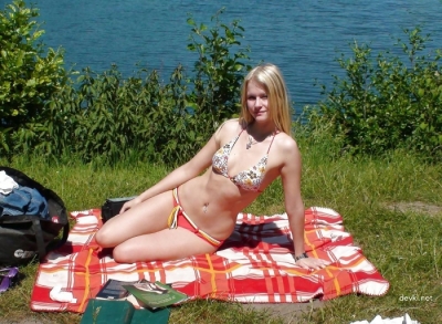 Slender blonde by the river