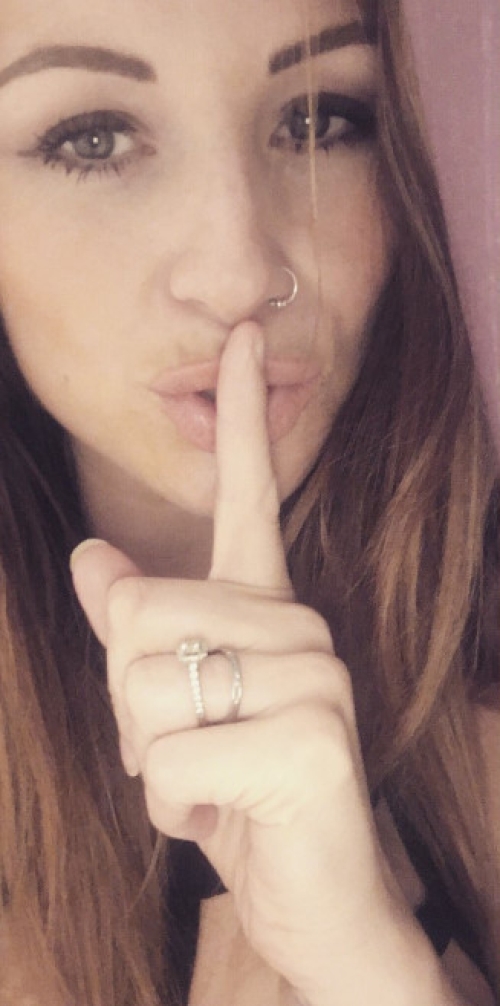 Exposed bare breasts: Explicit photo of a woman showing her naked chest