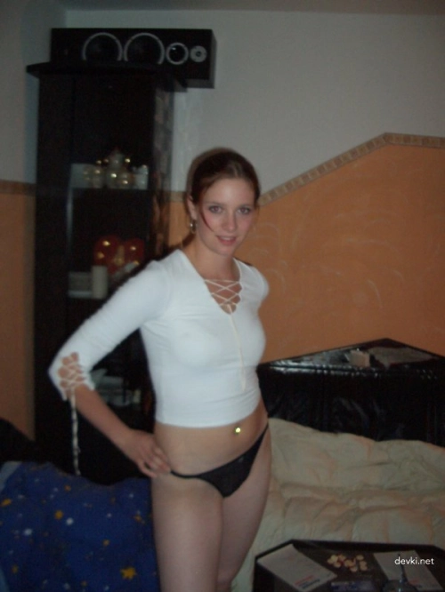 Teen girl shows off shaved pussy - explicit close-up photo
