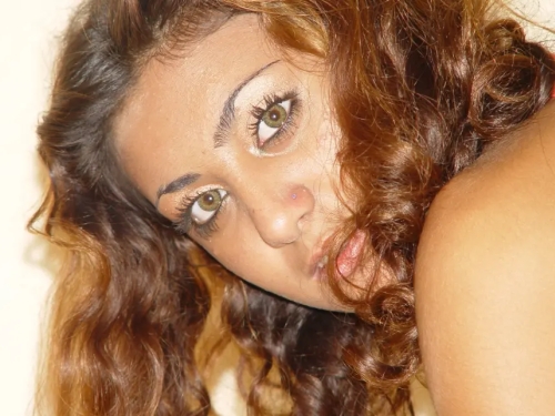 Curly Cutie Topless with Tan Showing Big Boobs - Explicit Nude Model Pose