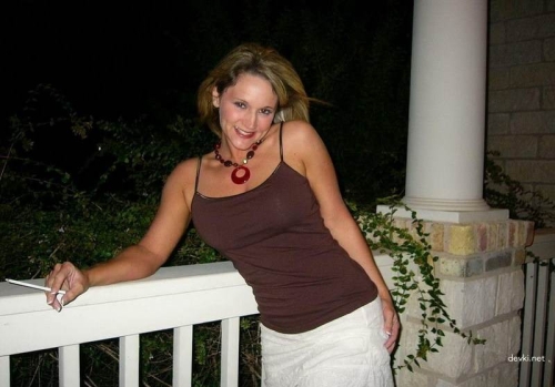 Mature Lady Flaunts Her Assets on the Balcony - Explicit MILF Display