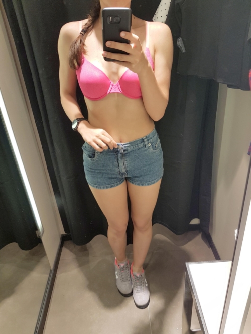 Spying in the mirror, I took off my shorts and showed off my wet panties and aroused pussy