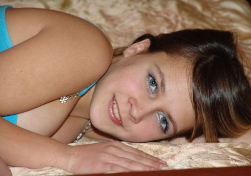 Seductive girl strips on bed, flaunts her body - Explicit Nude Photos