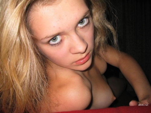 Happy Blonde Flaunts Small Breasts in Explicit Display