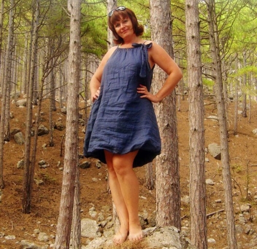 Hot mature woman looks incredibly sexy in the forest outdoors