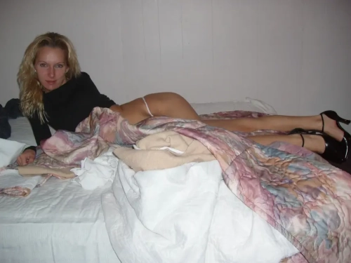 Slender babe with beautiful breasts shows off her pussy