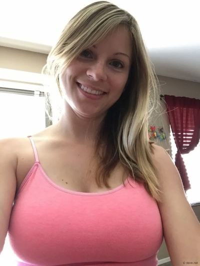 Cute smiling blonde with a nice pair of natural tits