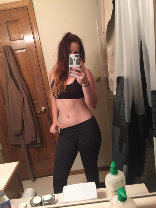 Sexy Girl Takes Selfie, Admiring Her Figure in Mirror