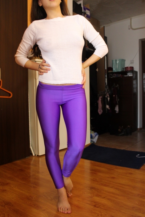 Young Slim Woman in Leggings Shows Off Naked Body