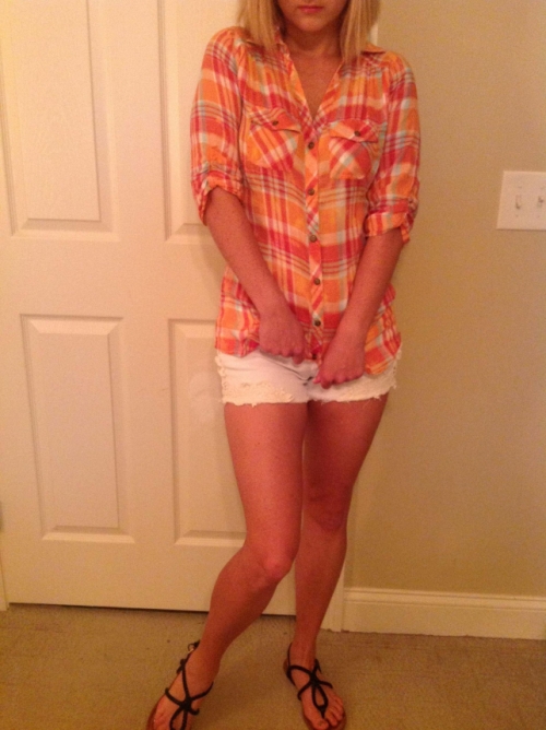 Girl strips to reveal body in white shorts and plaid shirt