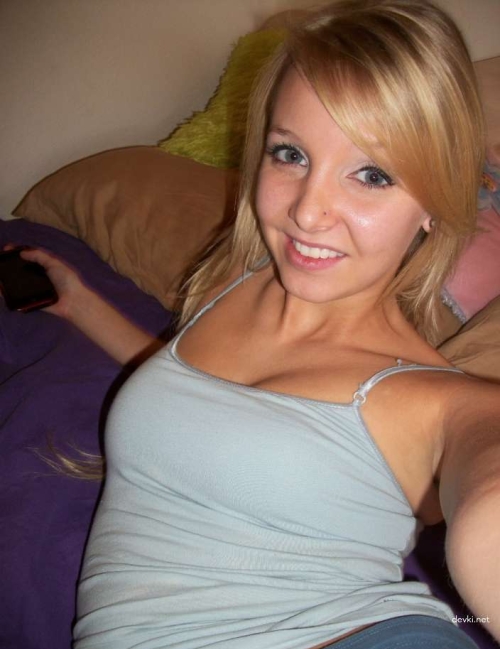 Sexy Tattooed Girl with Piercings Shows Off in Provocative Display