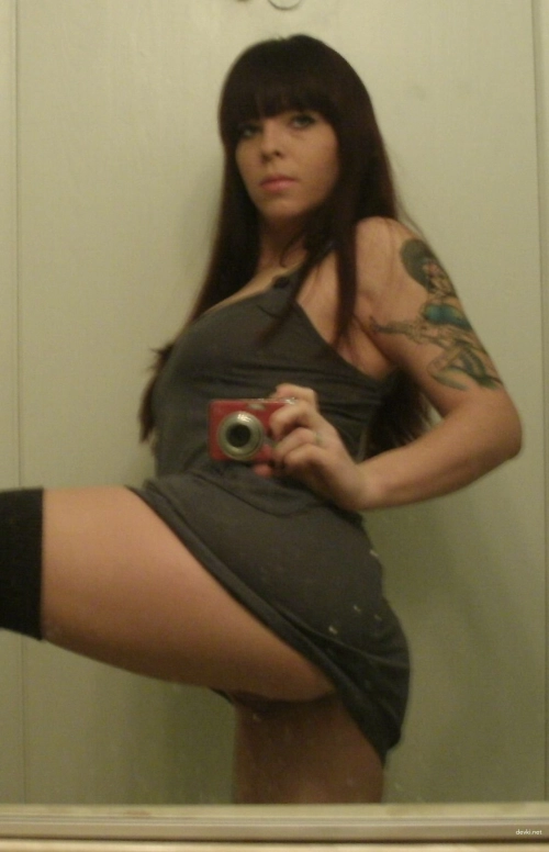 Naked girl takes explicit selfie: Hot young woman in provocative pose