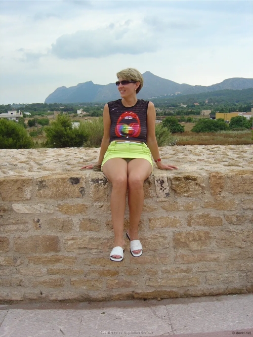 Mature Woman Relaxing on Vacation: Explicit and Sensual Beach Photoshoot