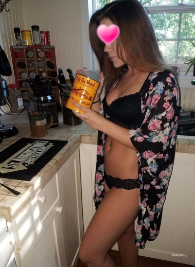 Naked wife makes coffee in the morning