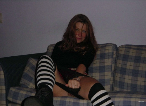Fiery Redhead Flaunts Her Shaved Pussy