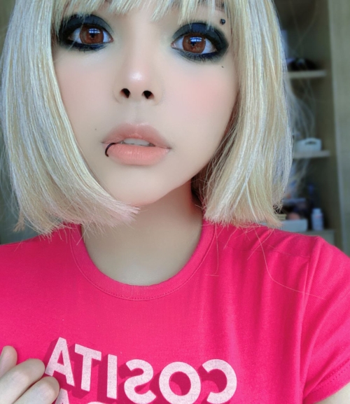 Busty cutie showing off in a pink top