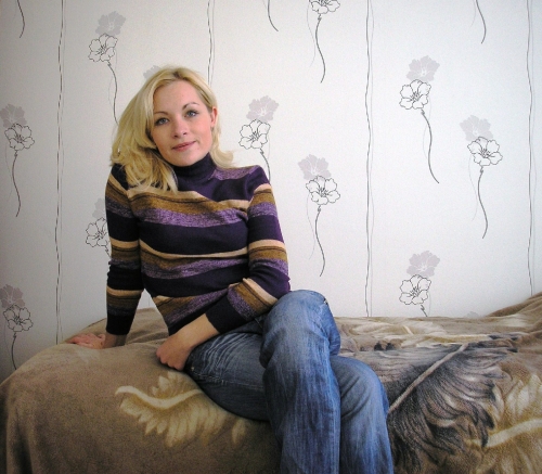 Cute blonde milf poses in a hot home photo shoot