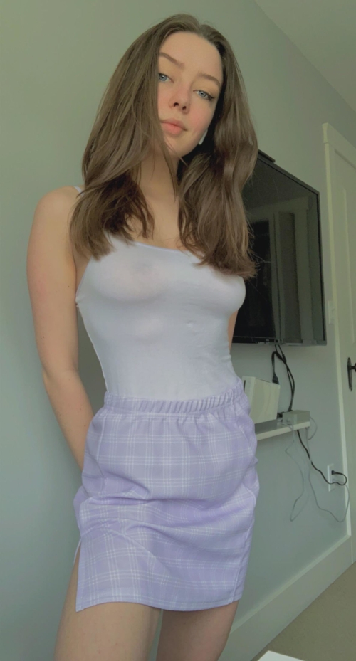 Slim brunette with long hair shows off her naked body