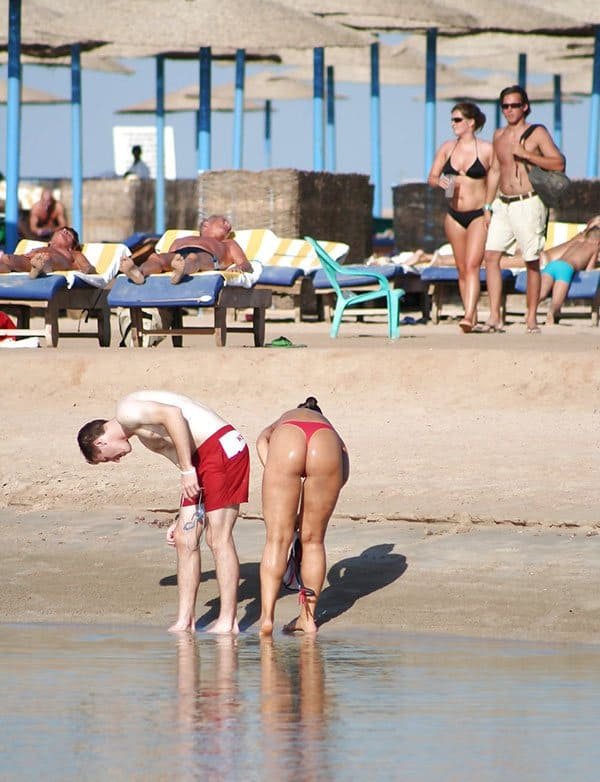 Girls in thongs on the beach