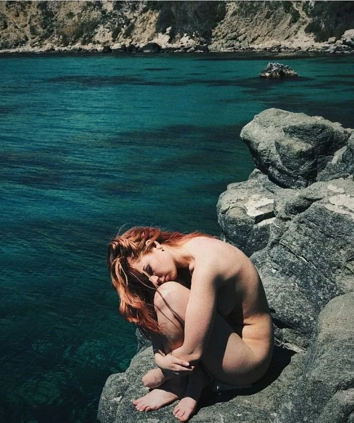 Beautiful lovers of relaxing in nature without clothes